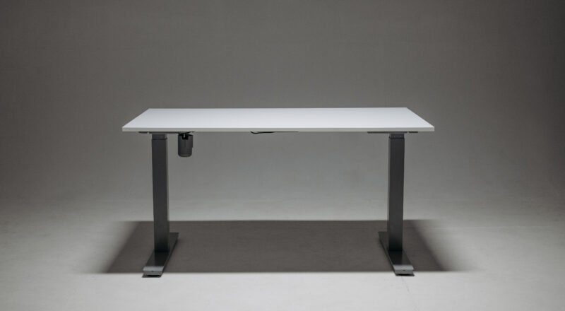Sleek adjustable height standing desk with a single motor for ergonomic office solutions.
